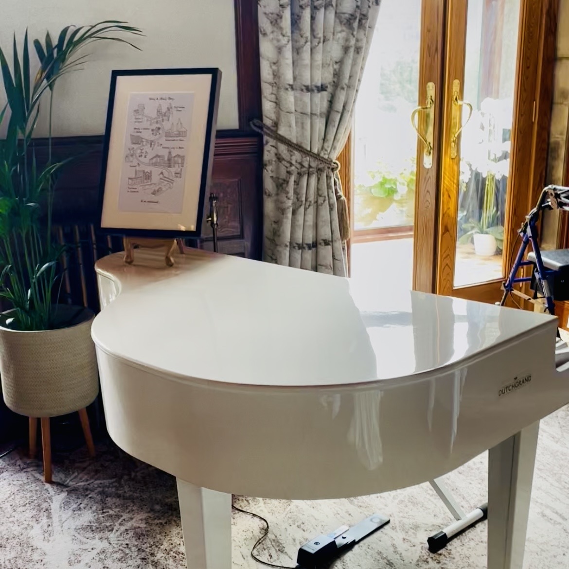 Armathwaite Hall pianist Craig Smith's white baby grand piano set up in the Dining Room ahead of an intimate wedding breakfast