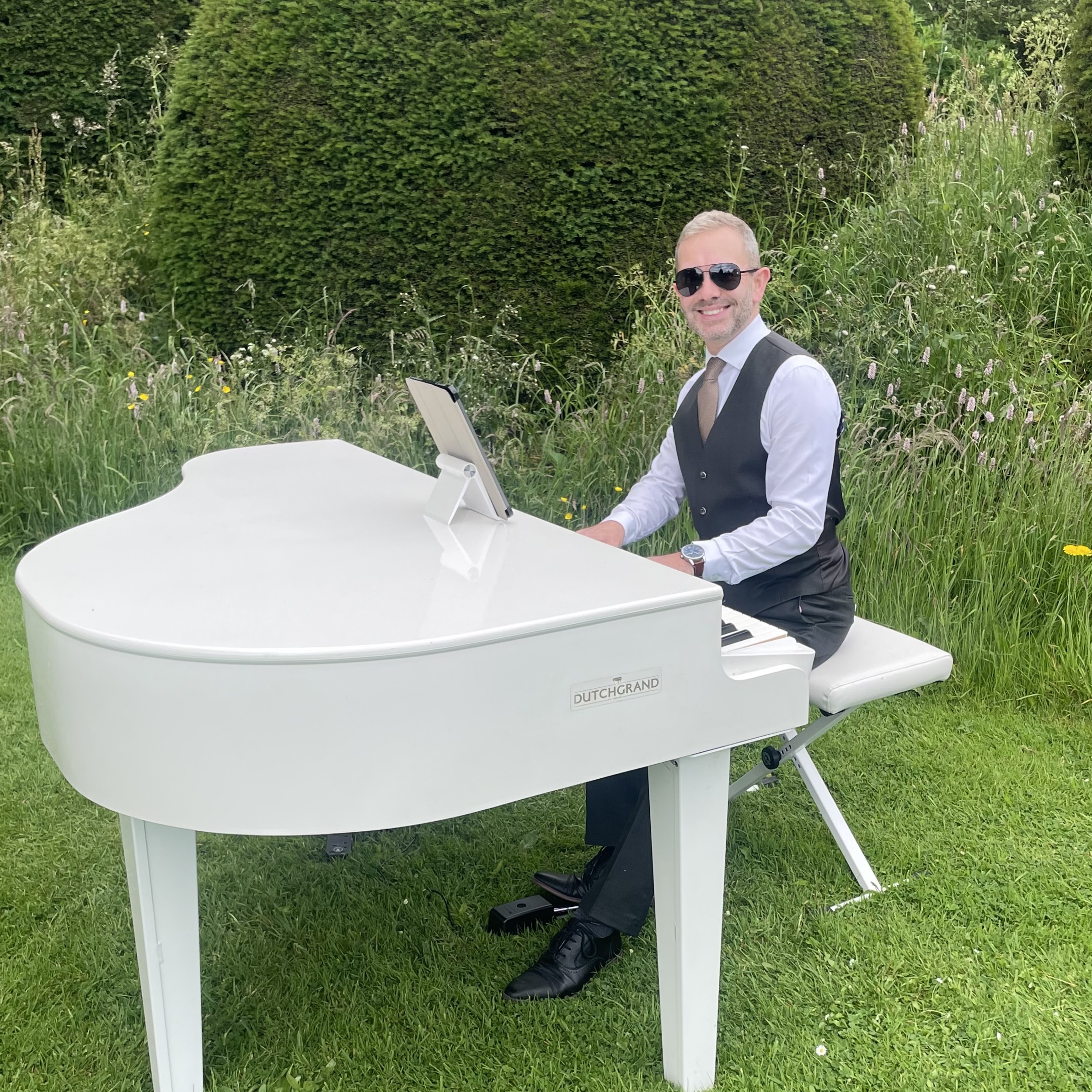 Wedding pianist Craig Smith plays piano music for a wedding ceremony at Askham Hall