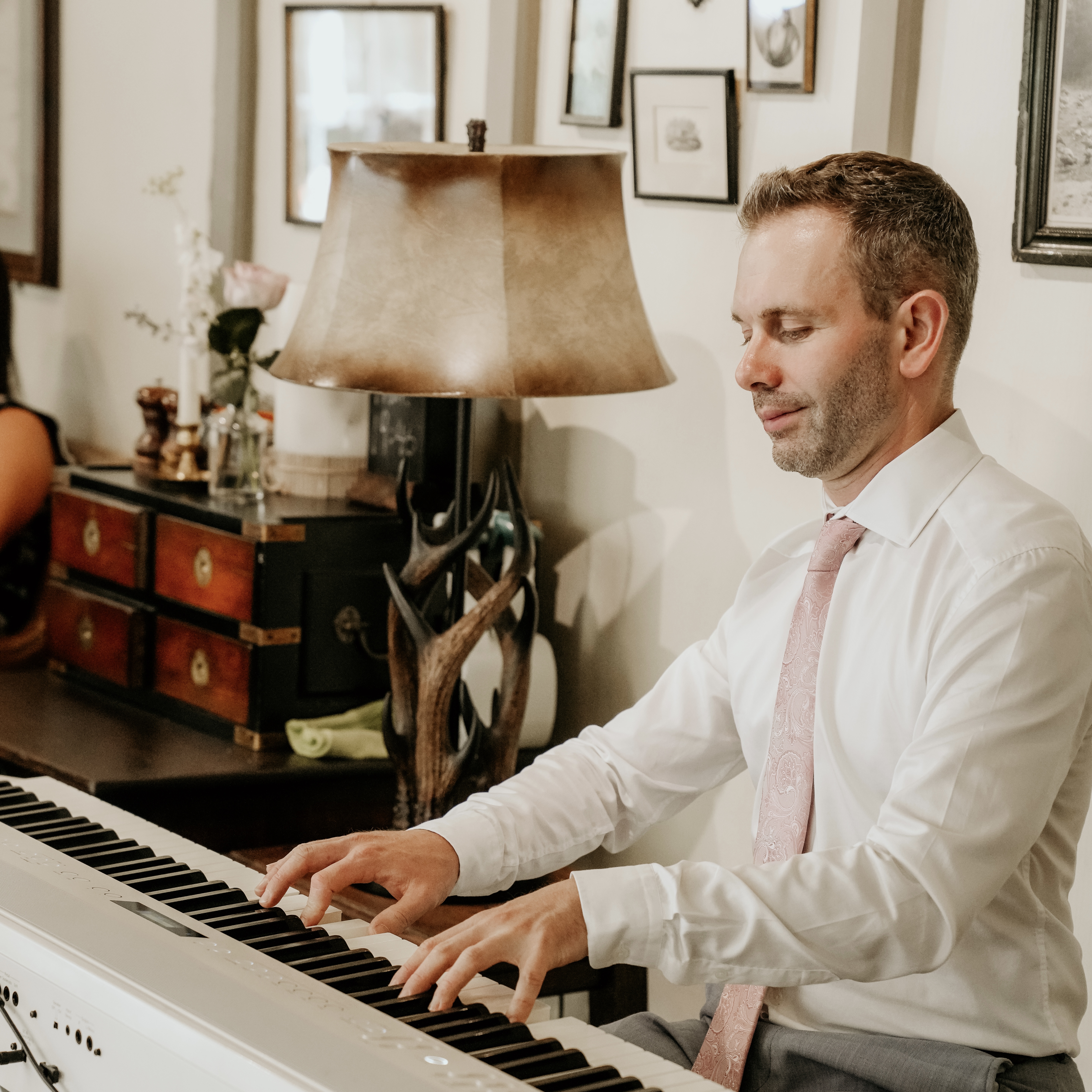 Live music at a Wild Boar Estate wedding by pianist Craig Smith during a drinks reception width=